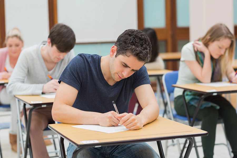 Students taking a test in a classroom in Queens